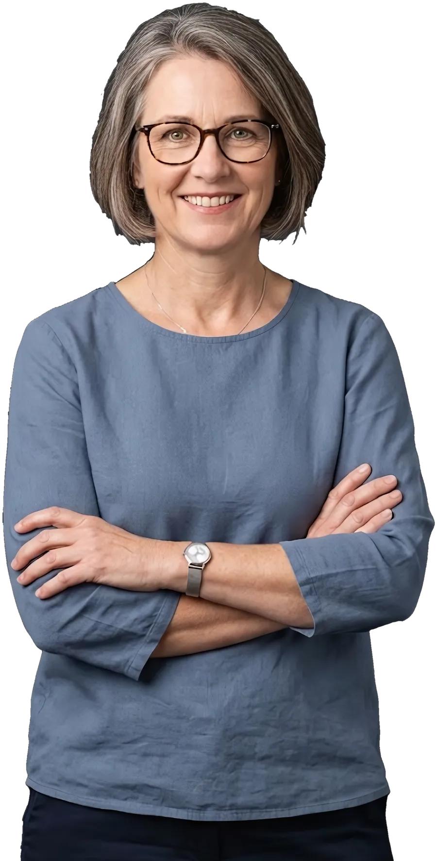 A bookkeeper in a smart top, arms crossed, smiling