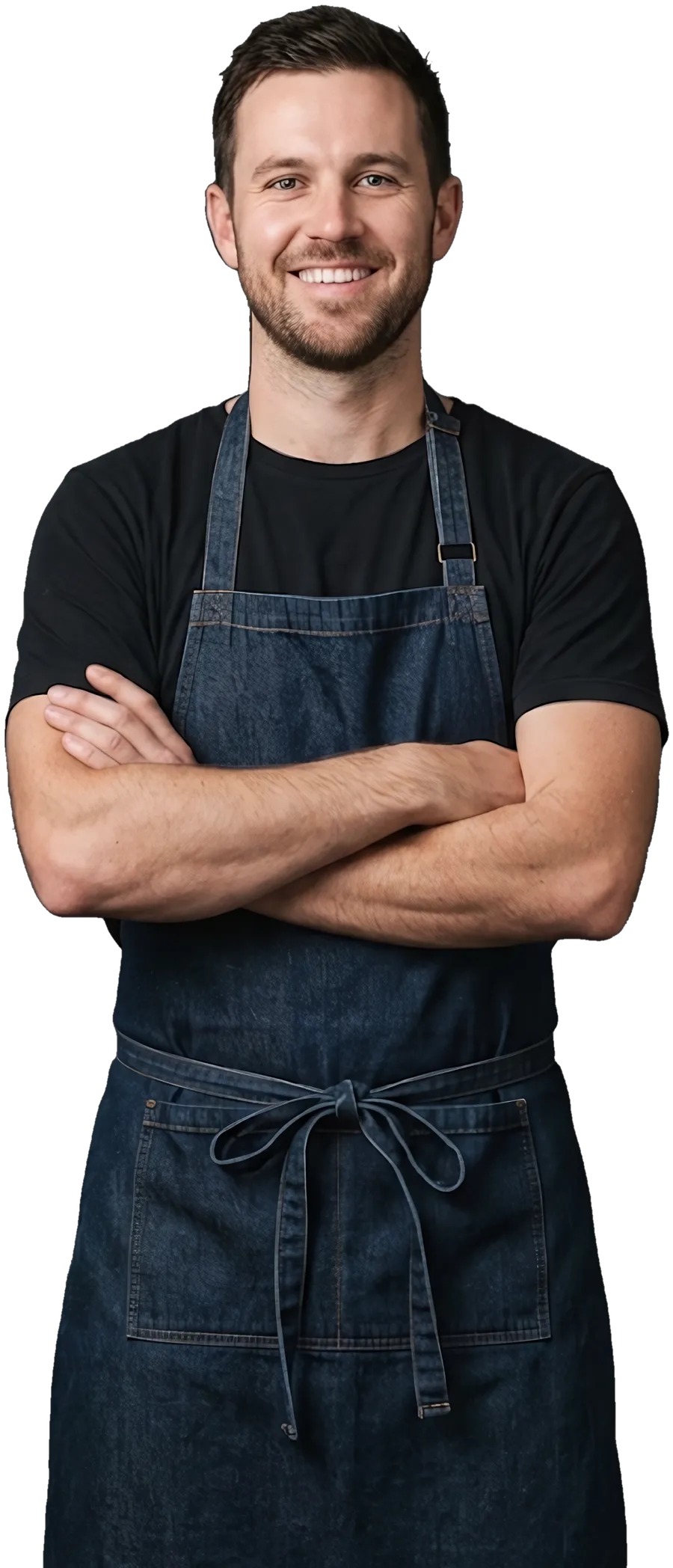 A cafe owner in an apron, arms crossed, smiling