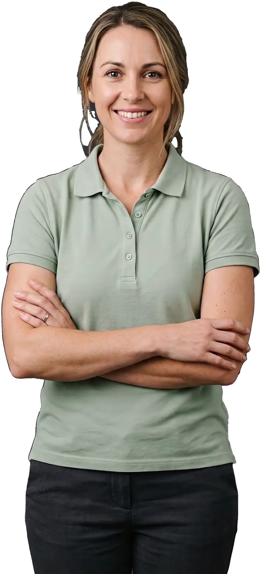 An early childhood educator in a centre polo, arms crossed, smiling