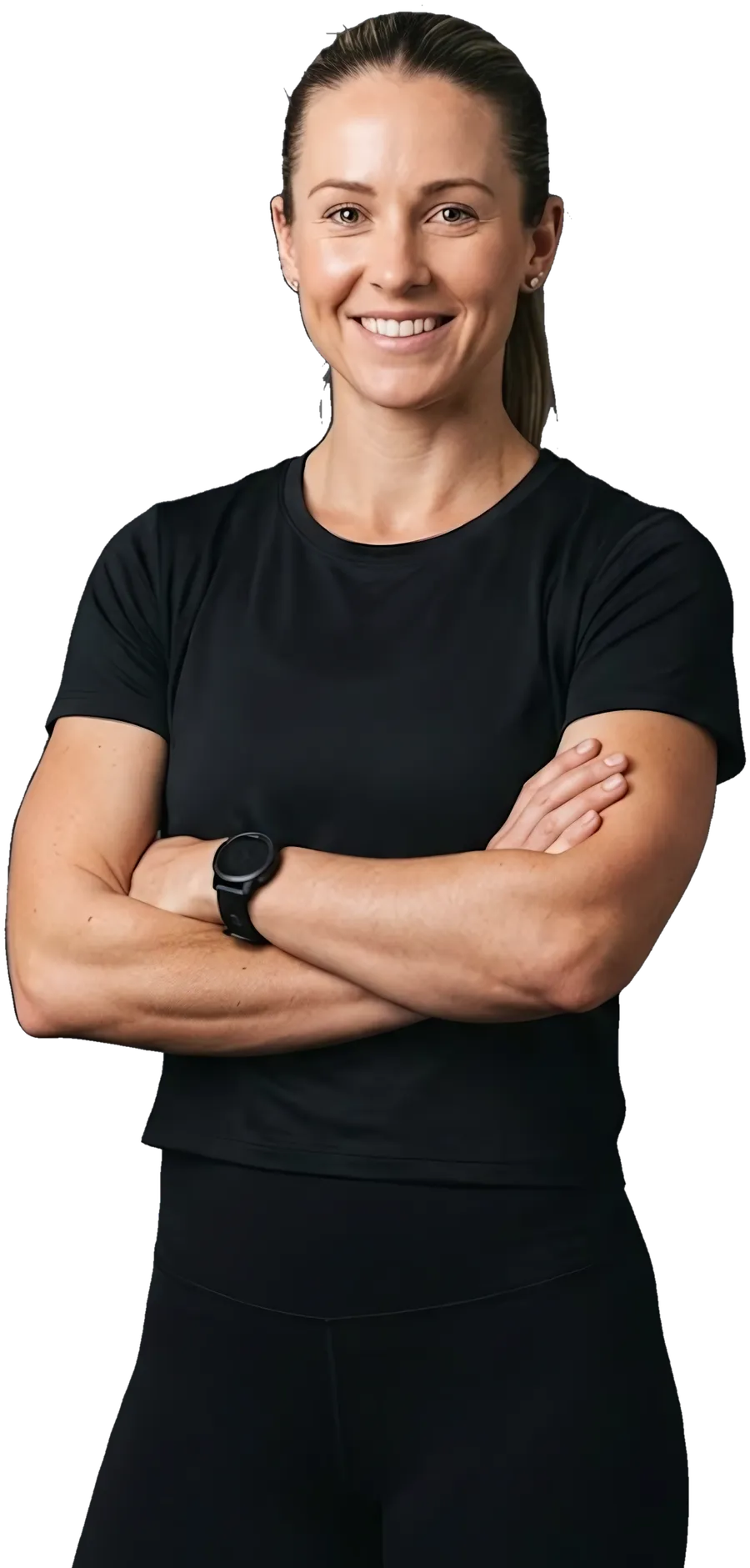 A gym owner in a training top, arms crossed, smiling