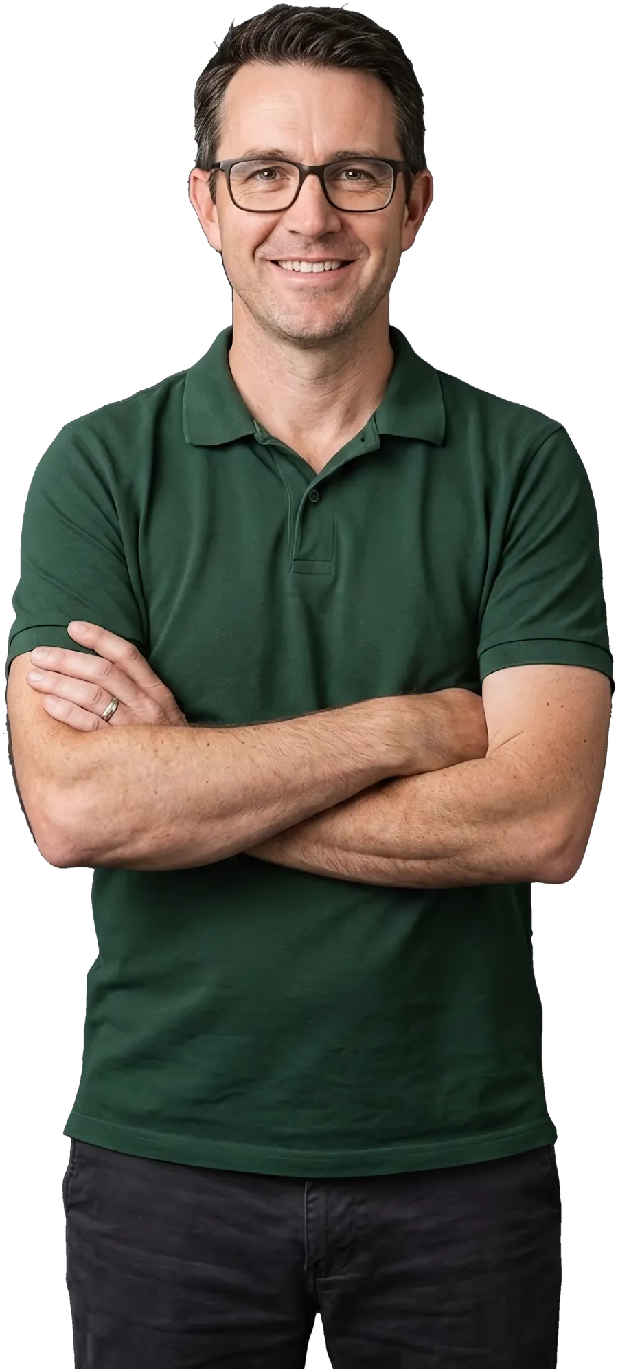 An IT services owner in a polo, arms crossed, smiling