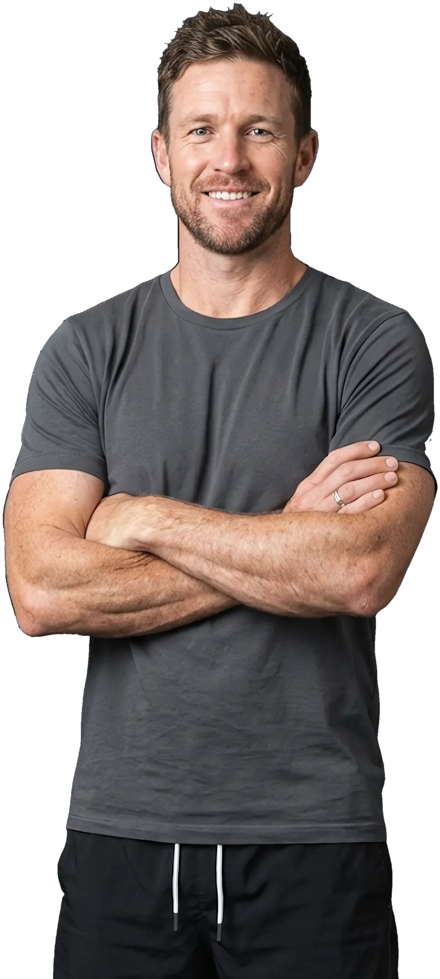 A personal trainer in a training top, arms crossed, smiling
