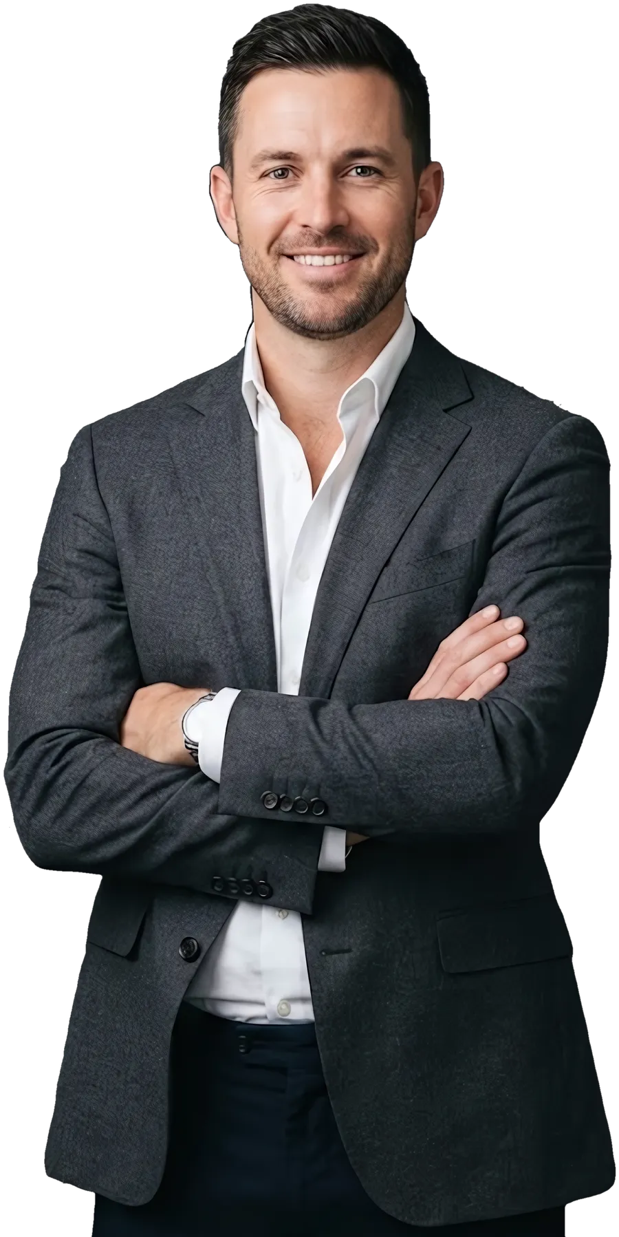A real estate agent in a blazer, arms crossed, smiling