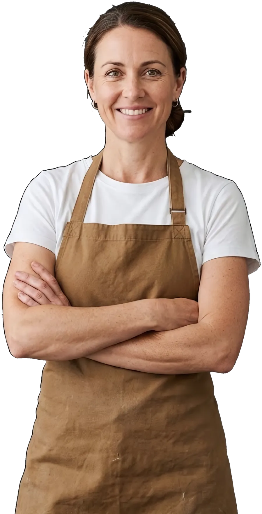 A cafe owner in an apron, arms crossed, smiling