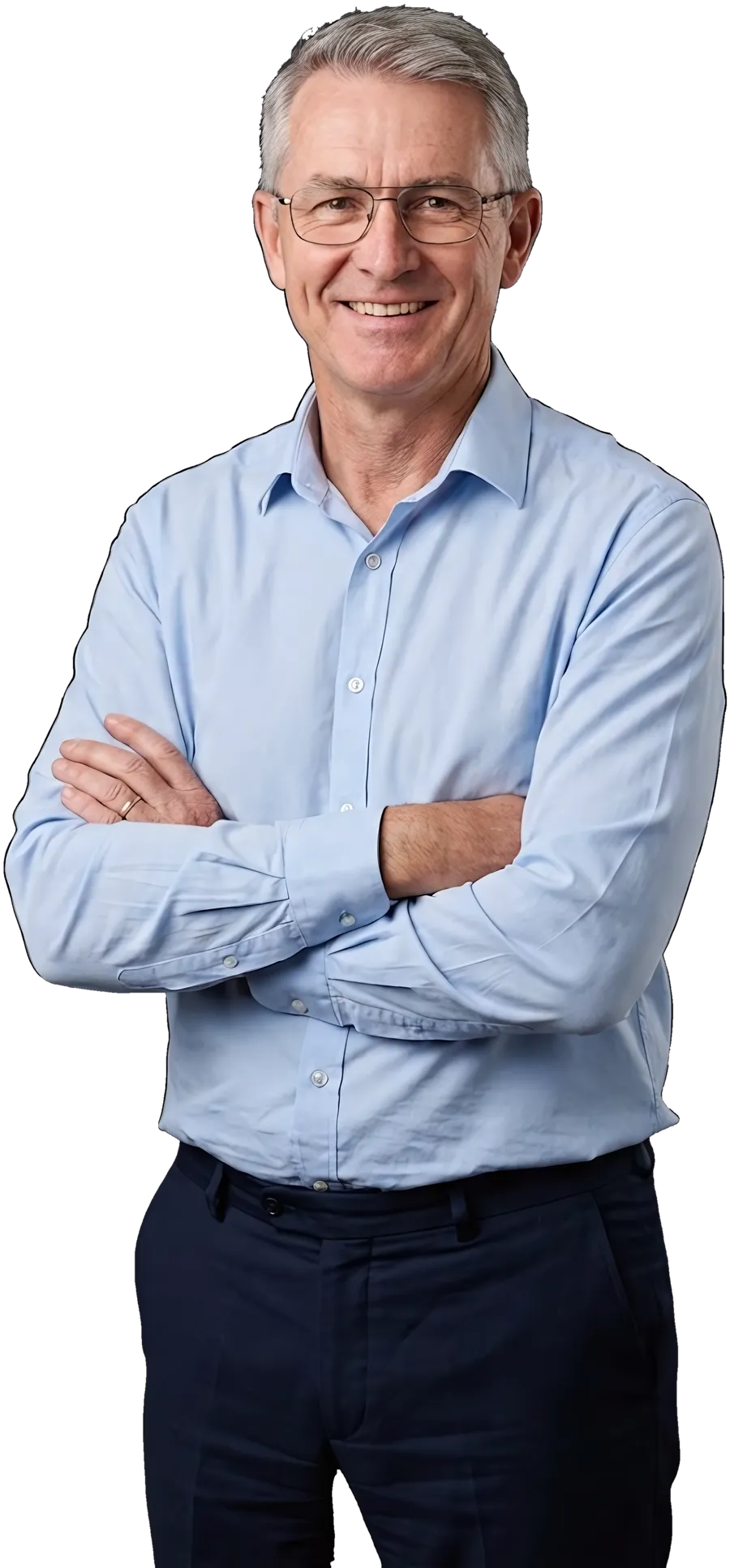 A school principal in a shirt, arms crossed, smiling