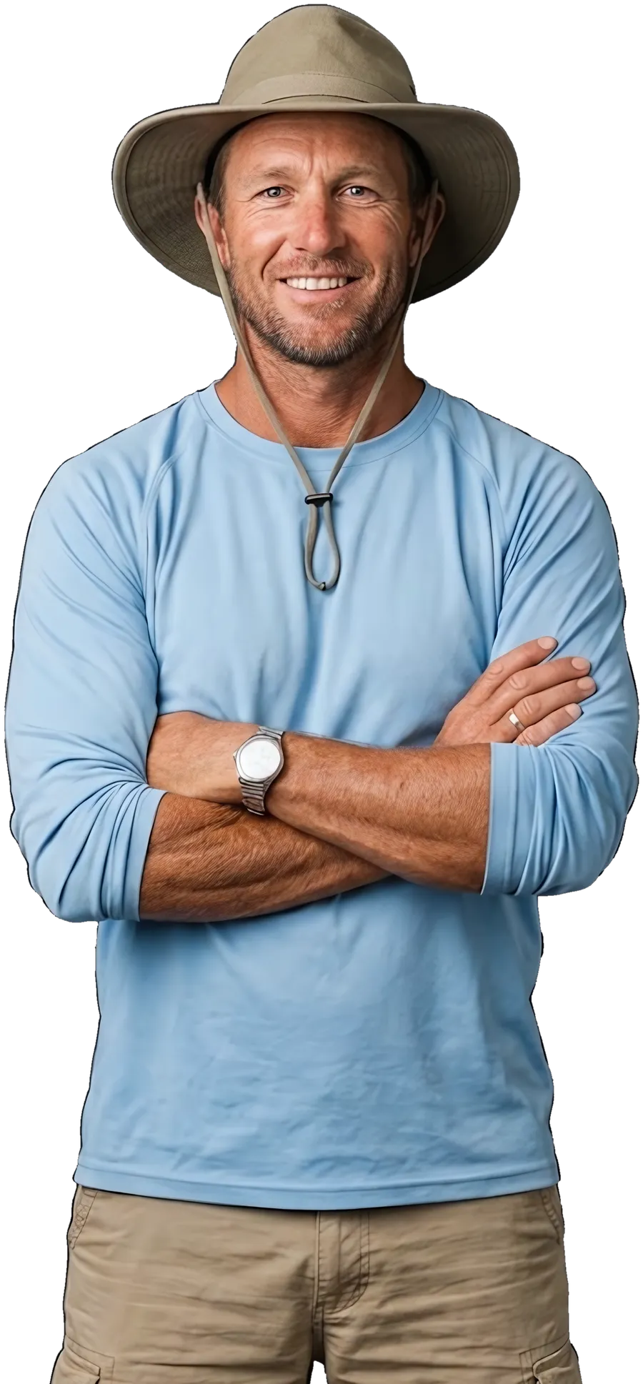 A tour operator in a sun shirt and hat, arms crossed, smiling
